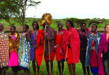 A Maasai community welcome is warm and colorful. (Carla Hunt)
