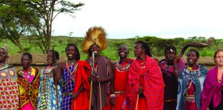 A Maasai community welcome is warm and colorful. (Carla Hunt)