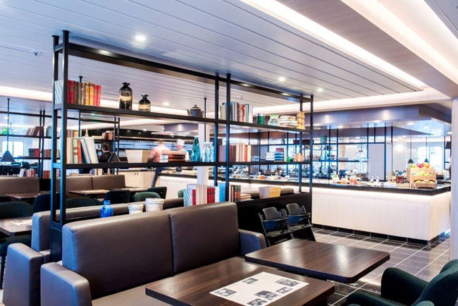 The dining room on Hurtigruten's refurbished MS Polarlys vessel feature modern Scandinavian design elements.