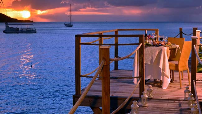 Guests can enjoy a romantic sunset meal at the Grand Case Beach Club in St. Martin. 