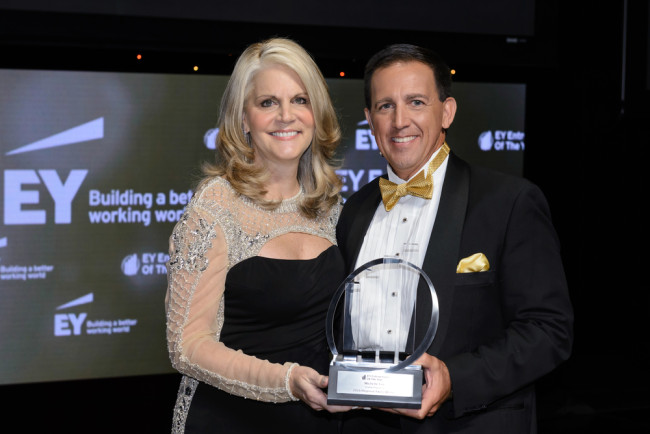 Michelle Fee, CEO of Cruise Planners, an American Express Travel Representative, being presented with the EY Entrepreneur Of The Year Award in Hospitality and Leisure. 