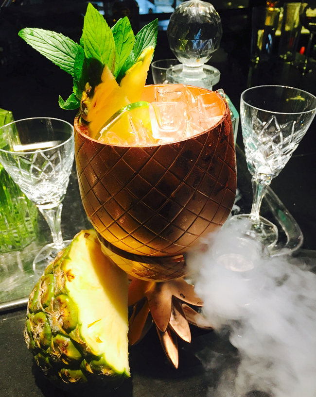 Gilt Lounge at QT Sydney in Australia is serving up Aussie-inspired spins on classic cocktails such as The Gilligan (pictured)—a take on rum punch. (Photo credit: QT Hotels & Resorts) 