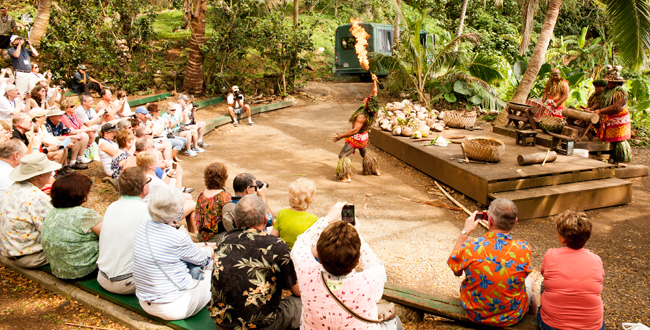 Chief Sielu and his Polynesian crew perform for YMT Vacations guests during one of the stops on our Circle Island Tour on Oahu.