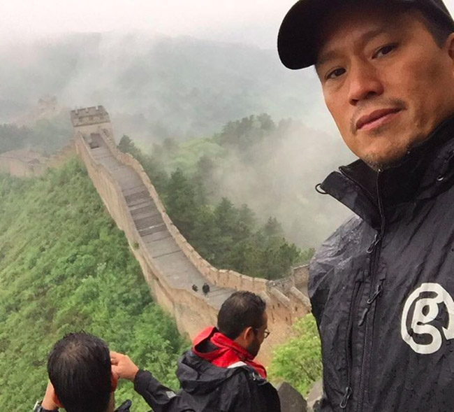 G Adventures founder Bruce Poon Tip at the Great Wall of China.