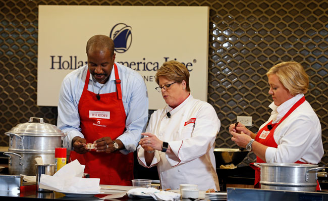 Holland America Line’s president Orlando Ashford participating in a demo of the line’s new onboard culinary program.