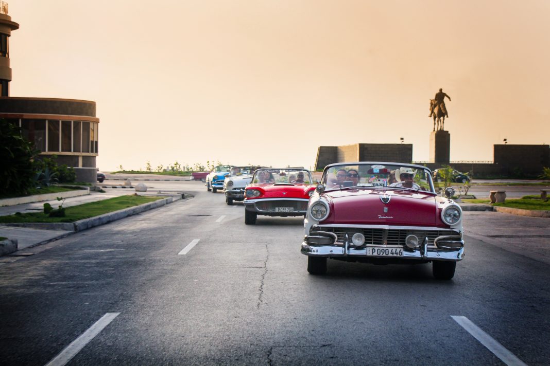 While in Cuba, travelers can ride around in vintage cars. (Photo courtesy of Travel Impressions.)