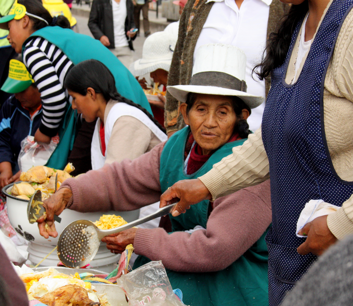 A woman serving food at the Inti Raymi Festival in Cusco. 