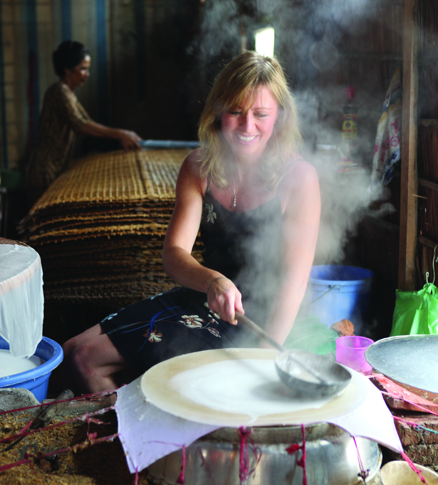 Kirstin making rice paper in Vietnam.