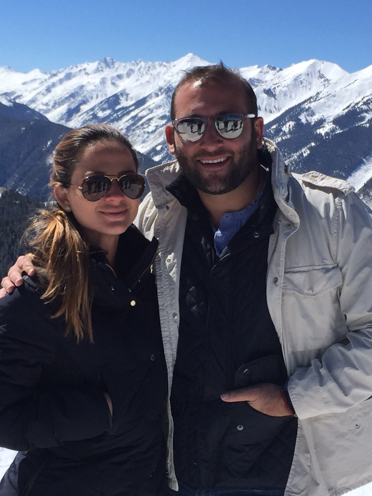 Keith and his wife enjoying the snow and mountain views.