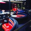 Mod interiors of The Tube, the Disney Fantasy's London Underground-themed bar.