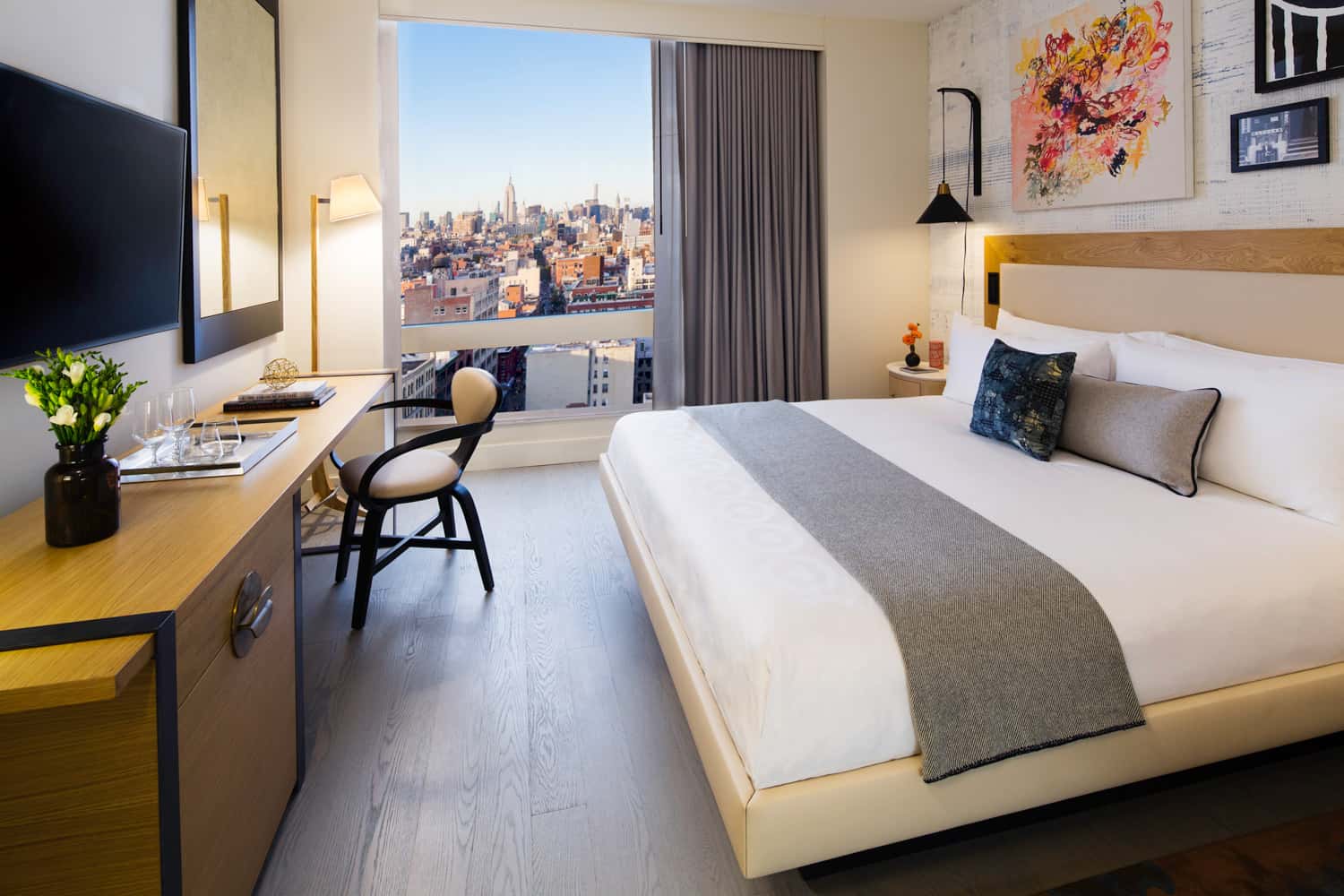 Guestrooms and suites at Hotel 50 Bowery in NYC feature distressed oak floors and luxe linens and a color palette of traditional chinaware colors of blue and white.
