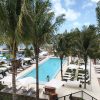 Views of the pool from our restroom, perfect with swinging hammocks and shady palm trees.