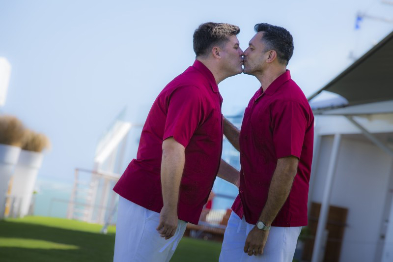 Celebrity Cruises hosts first legal same-sex marriage at sea.