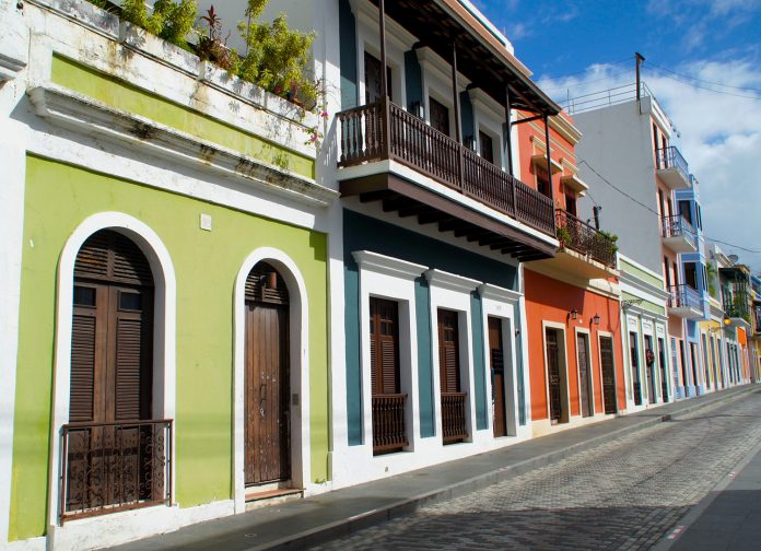 PR At the street level, the pastel-colored houses of Old San Juan seem unscathed by last year's Hurricane Maria. Photo Credit: Ed Wetschler