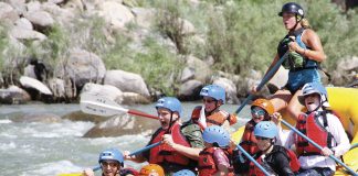 Taking on the rapids on the Yellowstone river. (Photo courtesy of Austin Adventures.)