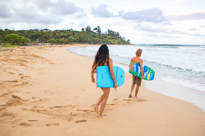 Body boarding at at Kealia Beach By Kapaa Kauai Hawaii